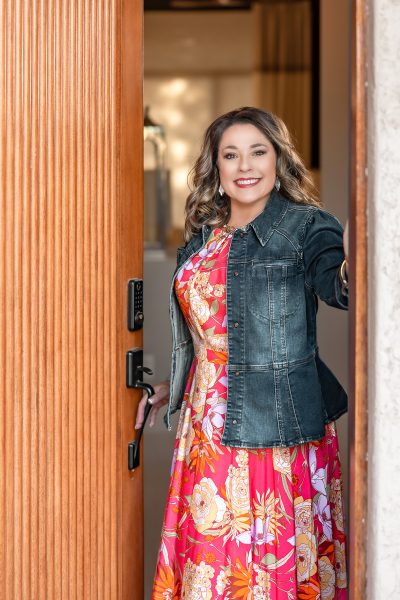 Athena Vigil portrait photo; she is standing inside an open doorframe